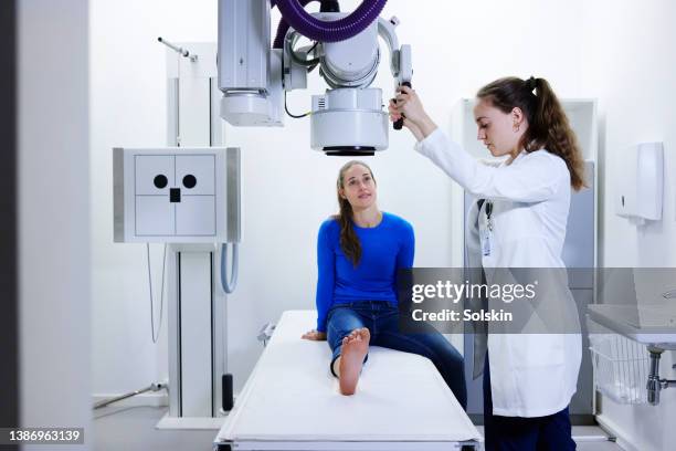 doctor examining and making x-ray of patients foot - human joint stock pictures, royalty-free photos & images