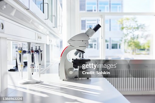 Microscope in empty science laboratory Microscope in empty science laboratory
