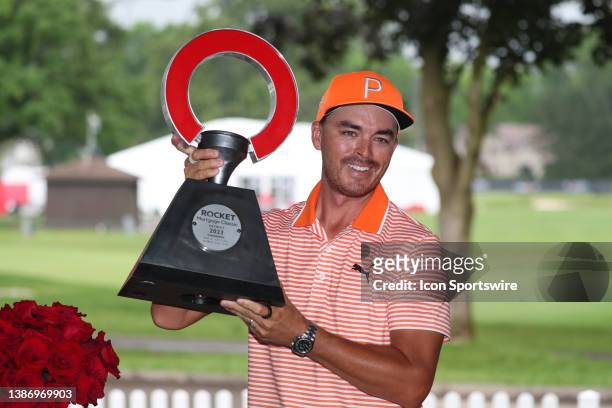 Golfer Rickie Fowler poses with the trophy on July 2 after the final round after winning the Rocket Mortgage Classic at the Detroit Golf Club in...