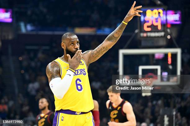 LeBron James of the Los Angeles Lakers waves to the crowd during the first quarter against the Cleveland Cavaliers at Rocket Mortgage Fieldhouse on...