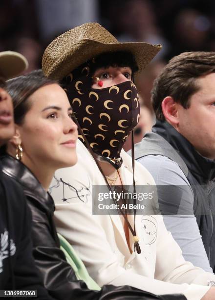 Rapper Bad Bunny looks on during the game between the Brooklyn Nets and the Utah Jazz at Barclays Center on March 21, 2022 in New York City. NOTE TO...