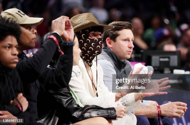 Rapper Bad Bunny looks on during the game between the Brooklyn Nets and the Utah Jazz at Barclays Center on March 21, 2022 in New York City. NOTE TO...