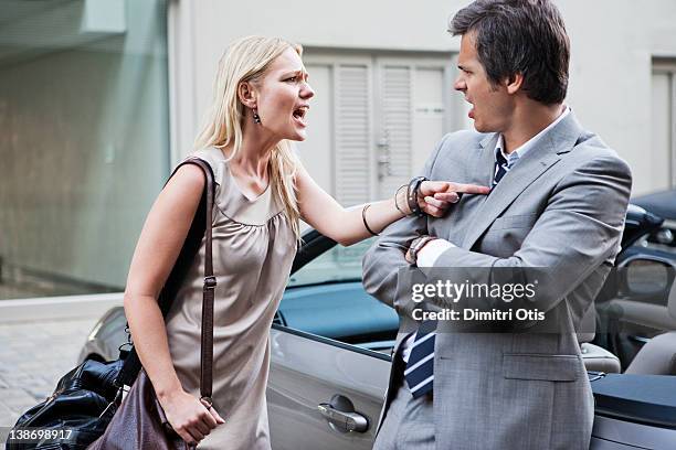 angry woman shouting at man whist having argument - arguing stock pictures, royalty-free photos & images