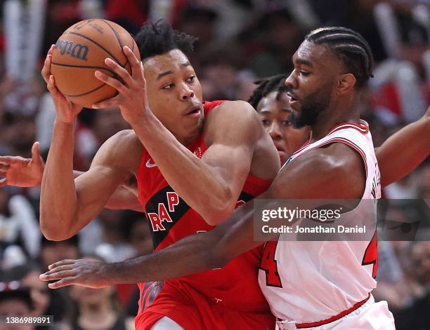 Patrick Williams of the Chicago Bulls defends against Scottie Barnes of the Toronto Raptors in Thomas' return from a long injury layoff at the United...