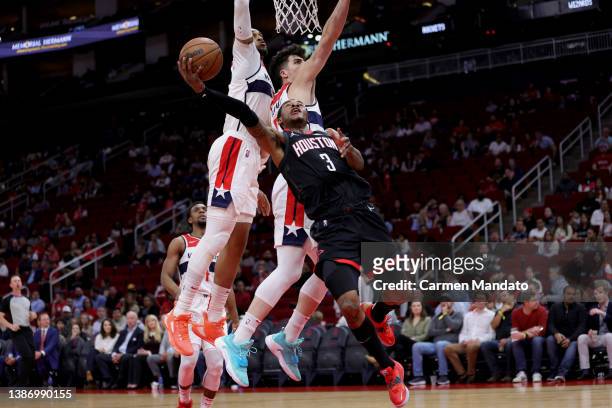 Kevin Porter Jr. #3 of the Houston Rockets drives to the basket during the second quarter against the Washington Wizards at Toyota Center on March...
