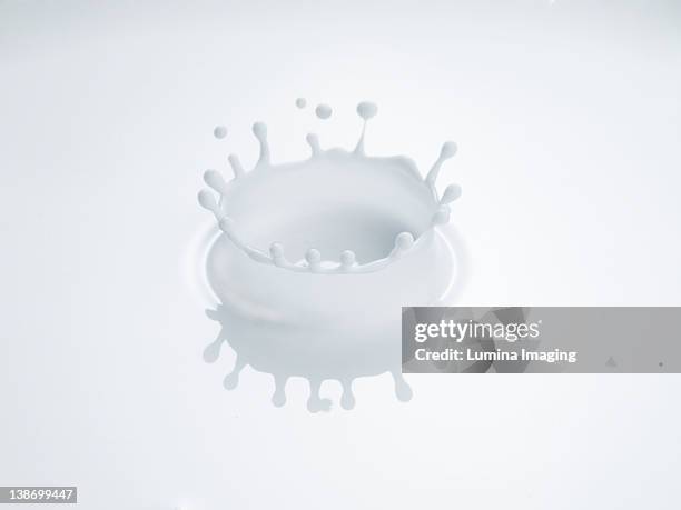 milk splash - splash crown stock pictures, royalty-free photos & images