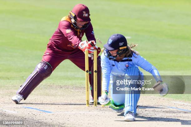 Anika Learoyd of the Breakers is stumped by wicketkeeper Caitlin Mair of the Fire during the WNCL match between New South Wales and Queensland at...