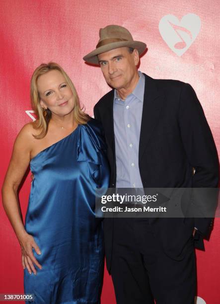 Singer James Taylor and Kim Smedvig arrive at the 2012 MusiCares Person of the Year Tribute To Paul McCartney held at the Los Angeles Convention...