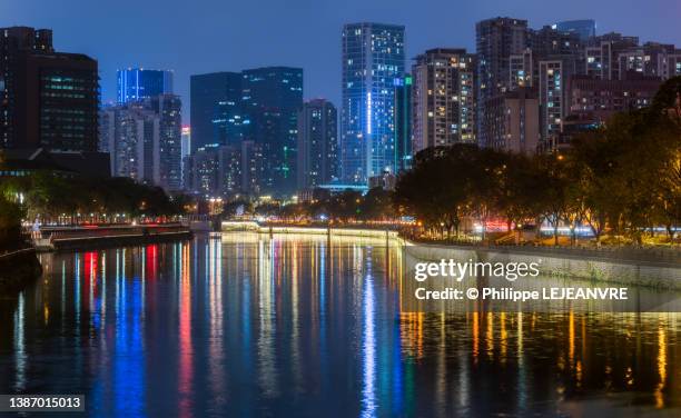 chengdu skyline at night from jinjiang river banks - chengdu skyline stock pictures, royalty-free photos & images