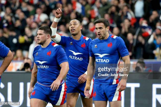 Gael Fickou of France celebrates his try - surrounded by Julien Marchand and Melvyn Jaminet - during the Guinness Six Nations Rugby match between...