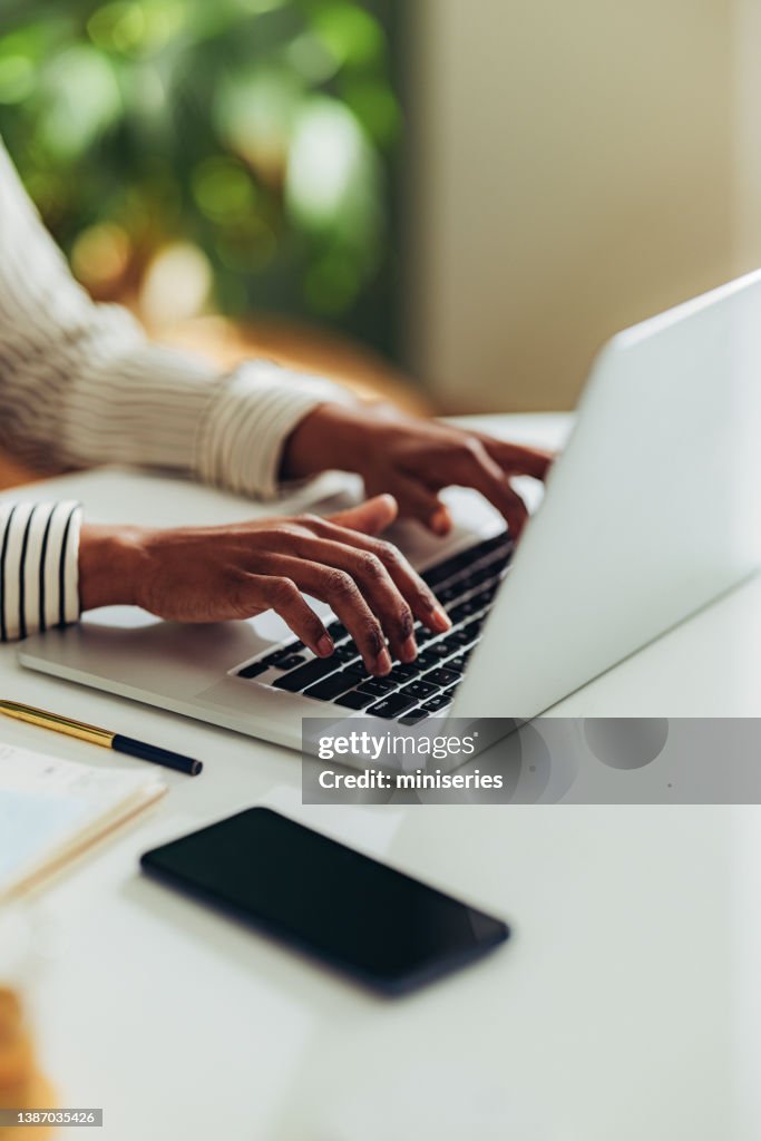 Close Up Photo of Woman Hands Using Laptop Computer in the Office