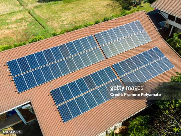 solar roof, solar panels on the roof in country house. - energia solar stock pictures, royalty-free photos & images