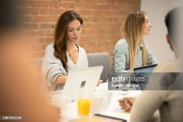 three business people in the office working together - england training session stock pictures, royalty-free photos & images