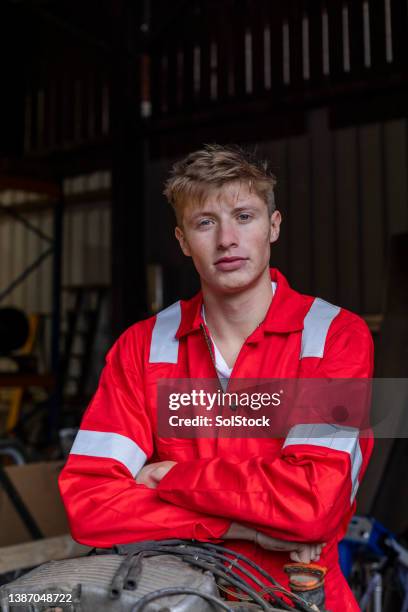 mechanic working hard - overall stockfoto's en -beelden