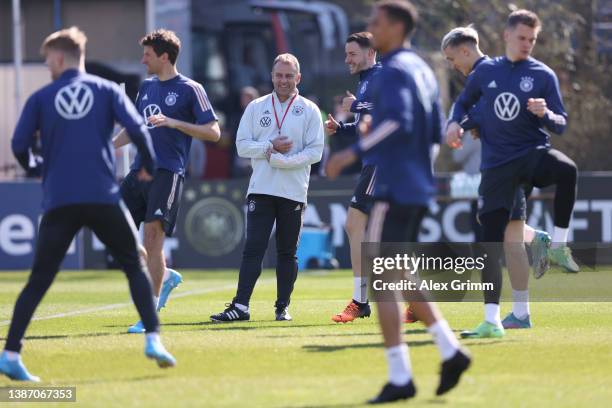 Head coach Hans-Dieter Flick reacts during a training session of Germany at the Eintracht Frankfurt training ground on March 22, 2022 in Frankfurt am...