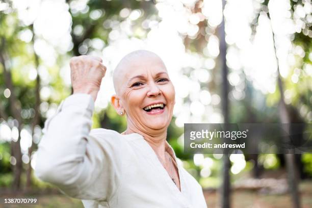 portrait of a woman with cancer oncology patient - shaved head stock pictures, royalty-free photos & images