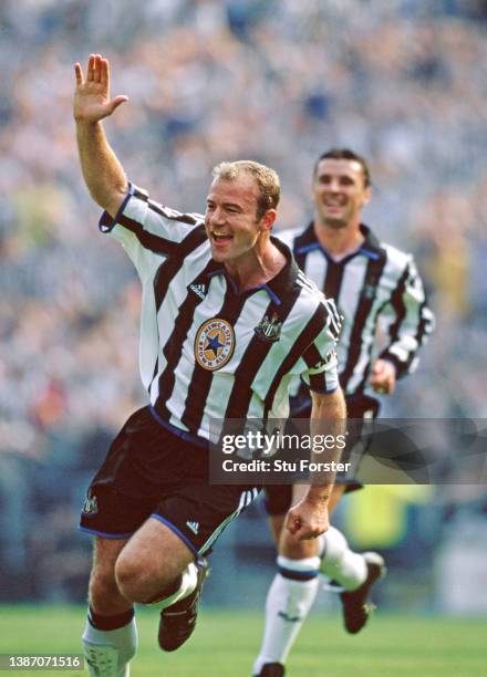 Newcastle United striker Alan Shearer celebrates after scoring the second Newcastle goal with his trademark one arm celebration as Gary Speed looks...