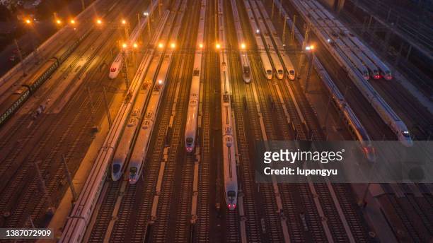 aerial view of high speed train at night - china high speed rail stock pictures, royalty-free photos & images