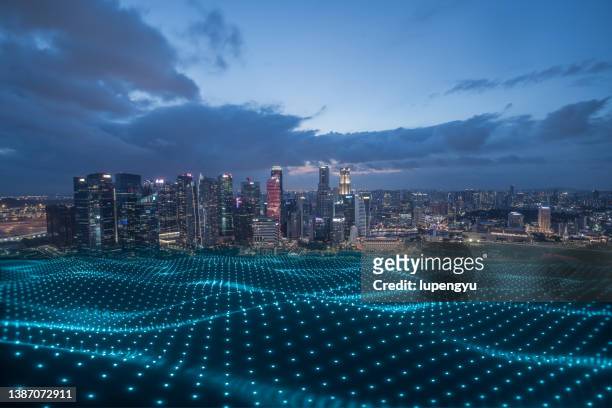 cityscape with abstract particles - advanced singapore fotografías e imágenes de stock