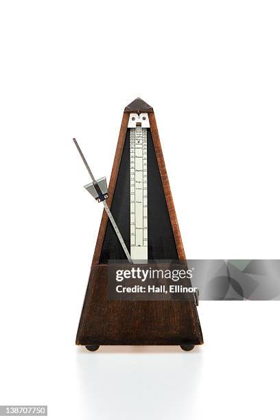 musical instrument on white background - metronome stock pictures, royalty-free photos & images