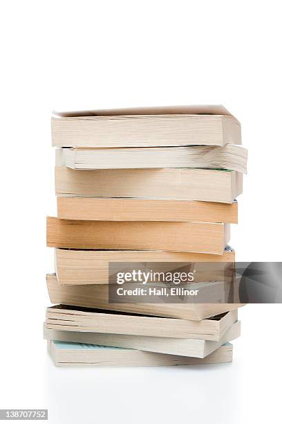 stack of books against white background, close-up - pile of books white background stockfoto's en -beelden