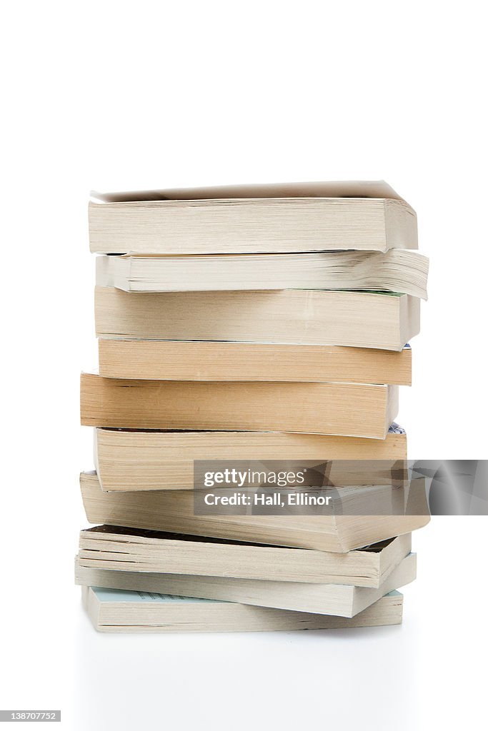 Stack of books against white background, close-up