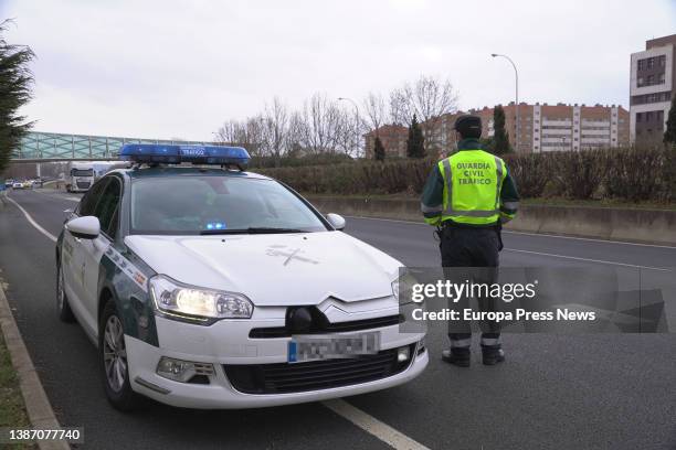 Vehicle and an agent of the Guardia Civil guards the slow march of trucks that has departed from La Grajera to the polygon of Cantabria during the...