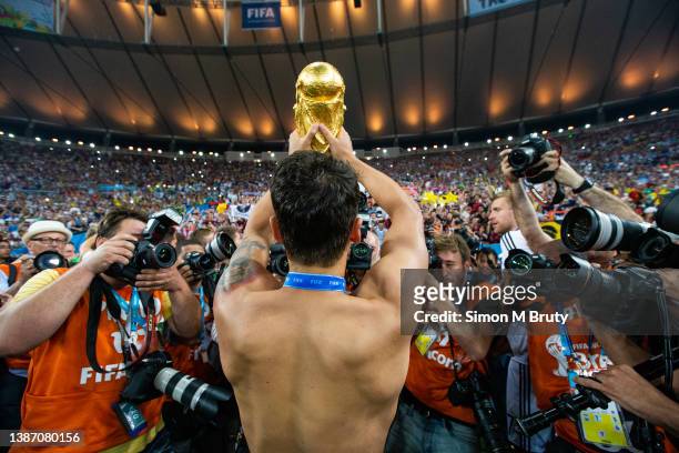 Mesut Oezil of Germany celebrates with the World Cup Trophy. World Cup Final match between Germany and Argentina at the Maracana Stadium on July 13,...