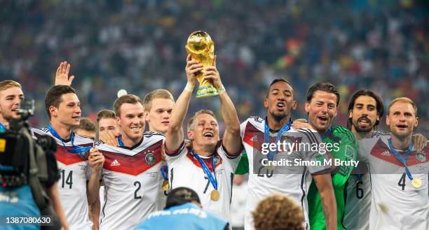 Bastian Schweinsteiger celebrates the World Cup victory with his teammates, Jerome Boateng, Roman Weidenfeller, Sami Khedira, Benedikt Hoewedes,...