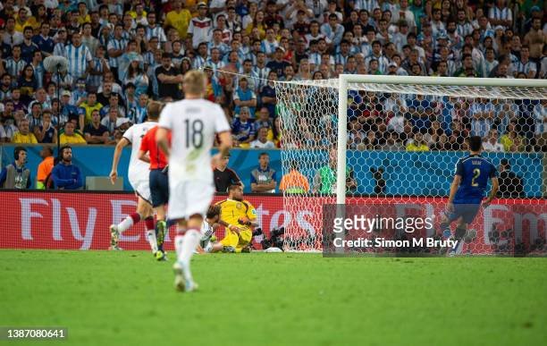 Mario Goetz of Germany scores in extra time past Sergio Romero goal keeper for Argentina during the World Cup Final match between Germany and...