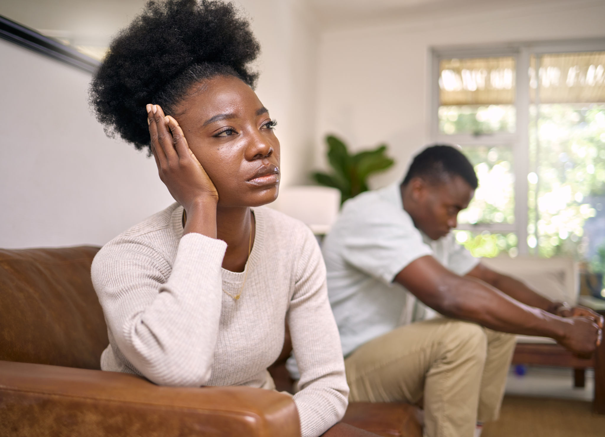 Shot of a young couple in an argument at home Shot of a young couple in an argument at home