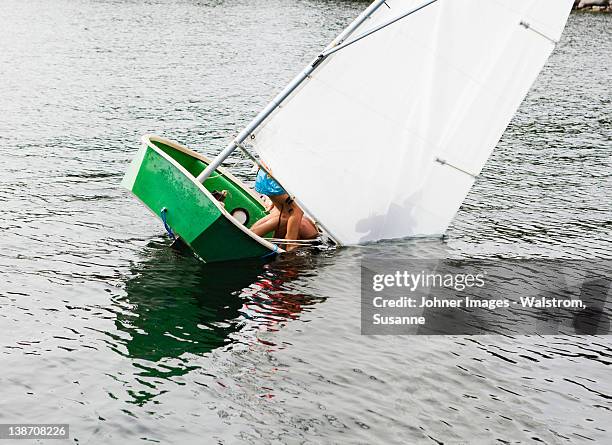 sailing dinghy falling into water - failure stock pictures, royalty-free photos & images