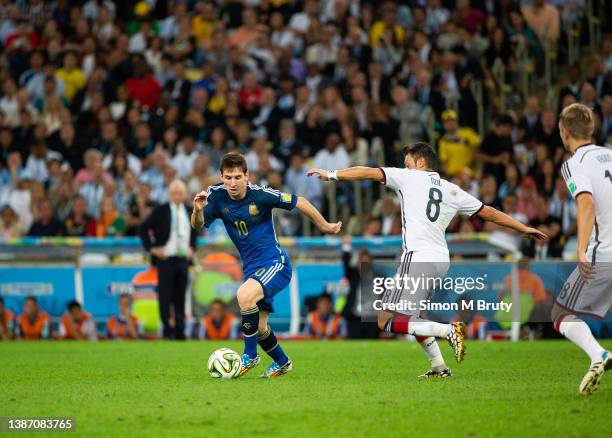 Lionel Messi of Argentina and Mesut Oezil of Germany during the World Cup Final match between Germany and Argentina at the Maracana Stadium on July...