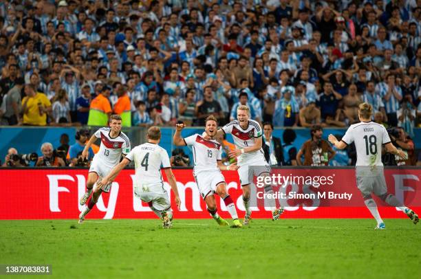 Mario Goetz of Germany celebrates his goal in extra time with Andre Schuerrle, Thomas Mueller, Benedikt Hoewedes and Toni Kroos, during the World Cup...