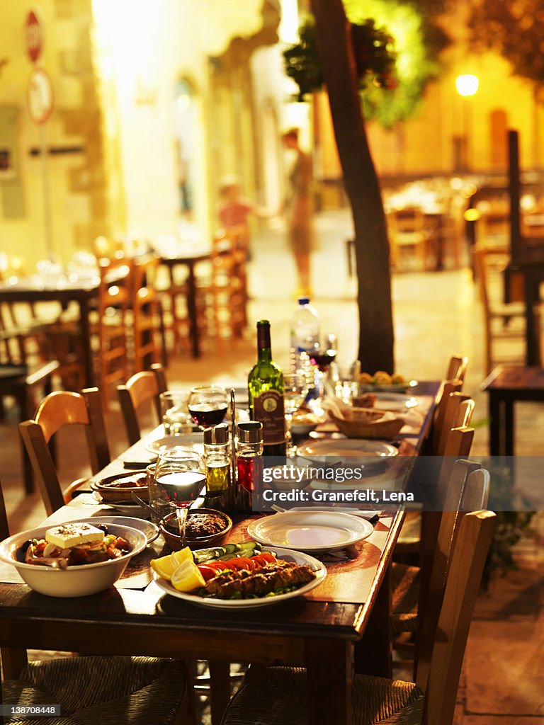 Dining table with food in street