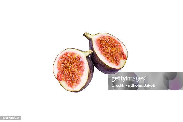 close-up studio shot of organic fig cross-section - fig stock pictures, royalty-free photos & images