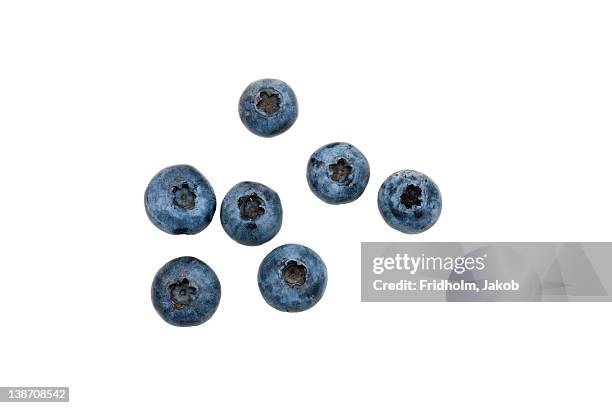 close-up studio shot of organic blueberries - summer fruit stock pictures, royalty-free photos & images