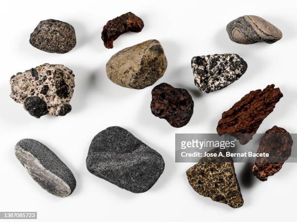 volcanic stones and boulders on a white background. - stone imagens e fotografias de stock