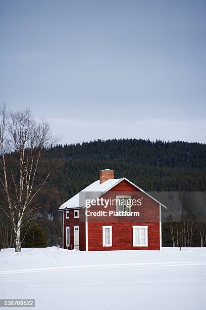 a red wooden house, norrland, sweden. - sweden winter stock pictures, royalty-free photos & images