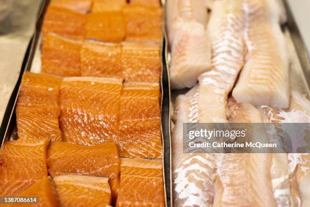 fresh raw salmon & cod fish filets at market - catch of fish stock pictures, royalty-free photos & images