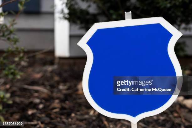 blank security system sign post in front of single-family residential home - alarm system stock pictures, royalty-free photos & images