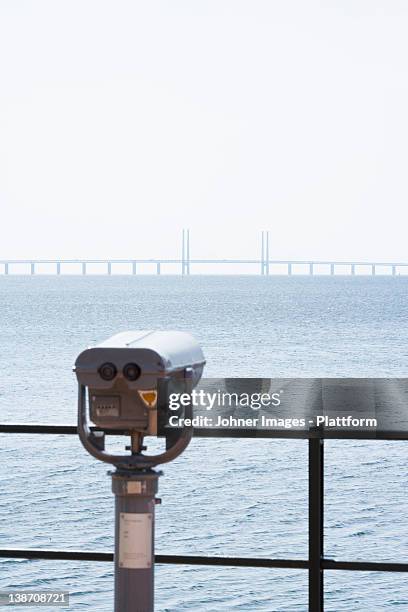 telescope by the ocean, malmo, sweden. - oresund bridge stock pictures, royalty-free photos & images