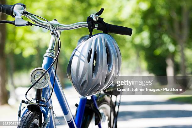 a bicycle and a safety helmet, sweden. - cycling helmet fotografías e imágenes de stock