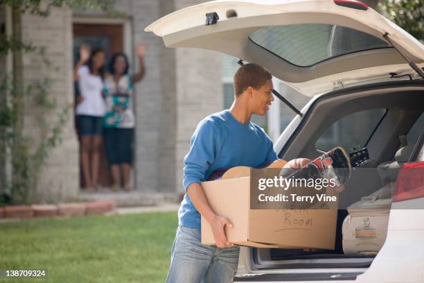 mixed race teenager loading car for college - houston texas family stock pictures, royalty-free photos & images