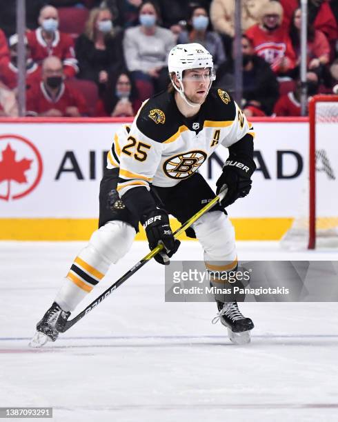 Brandon Carlo of the Boston Bruins skates against the Montreal Canadiens during the first period at Centre Bell on March 21, 2022 in Montreal,...