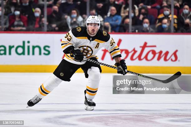 Brad Marchand of the Boston Bruins skates against the Montreal Canadiens during the second period at Centre Bell on March 21, 2022 in Montreal,...