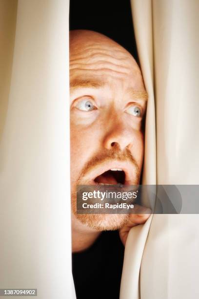 man parts his curtains and gets a terrible shock, making him gape - man open mouth stock pictures, royalty-free photos & images