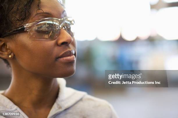 black worker in protective eyewear - eye protection fotografías e imágenes de stock