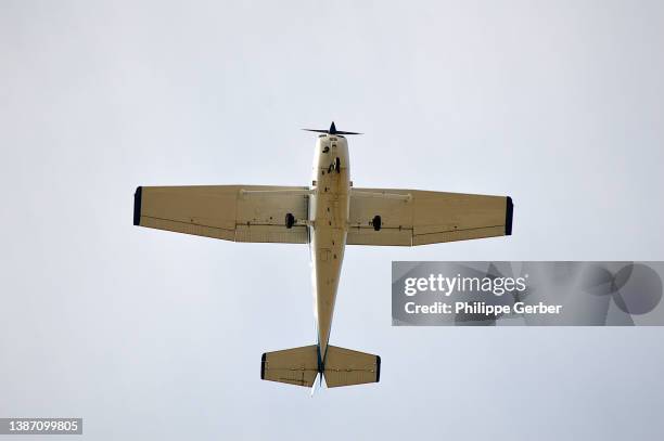 airplane flying against clear sky - propeller airplane bildbanksfoton och bilder