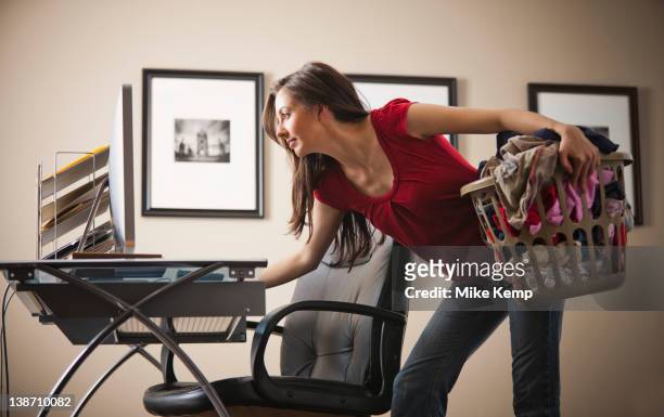 caucasian woman multi-tasking home office - multitasking woman stock pictures, royalty-free photos & images